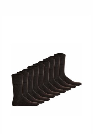 Zehn Paar schwarze, wadenlange Socken, in zwei Reihen angeordnet, alle nach rechts gerichtet auf weißem Hintergrund.