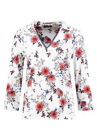 Blumenbluse mit langen Ärmeln aus weißem Stoff, mit roten und blauen Blumen sowie grünen Blättern, V-Ausschnitt und geknöpften Ärmeln.
