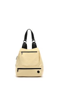 Zaino color crema in nylon morbido, dotato di spallacci neri, due tasche frontali con zip e un dettaglio del logo in rilievo circolare.