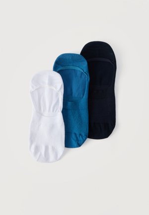 Trois paires de socquettes invisibles en blanc, sarcelle et noir, disposées côte à côte sur un fond blanc uni.