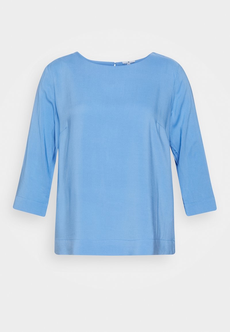 Vaaleansininen, 3/4-hihainen paita, jossa on pyöreä pääntie, sileä pinta ja suora leikkaus. Sisältää minimaalista ommelta eikä näkyviä kuvioita.