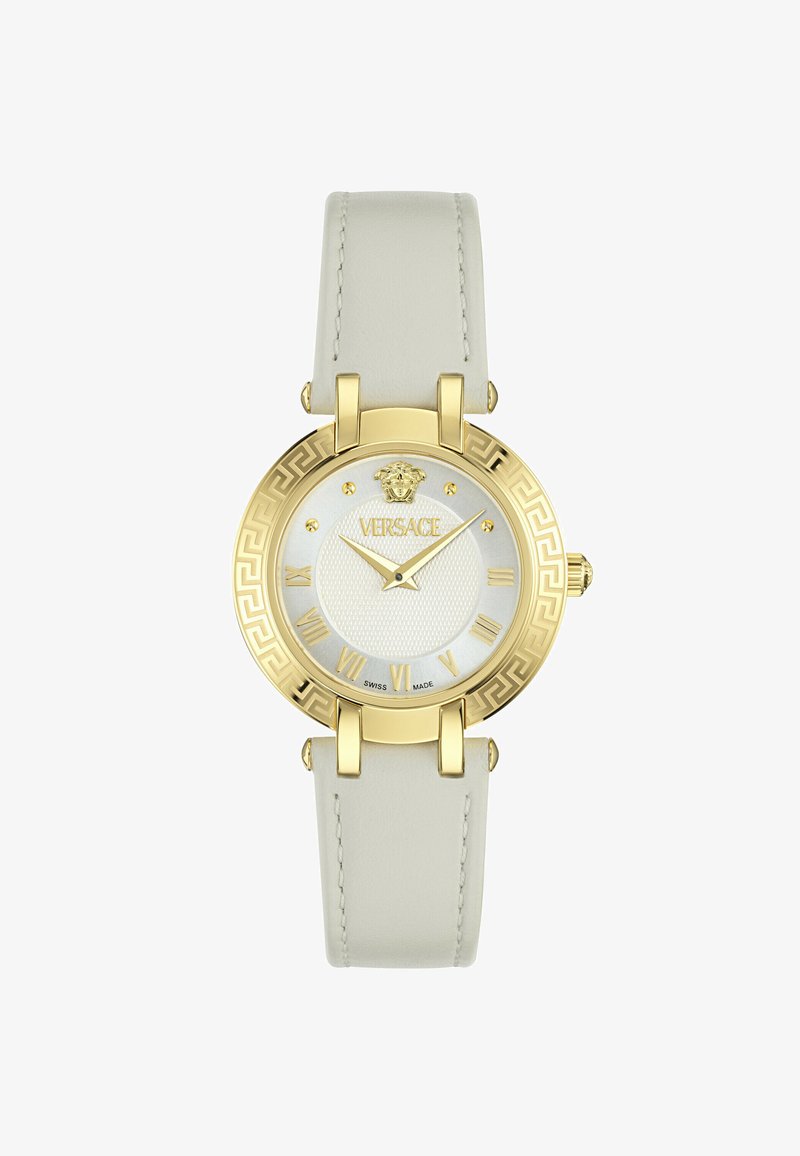 Arany színű óra fehér textúrájú számlappal, római számokkal és krémszínű bőrszíjjal. A Versace logójával és bonyolult keretmintával rendelkezik.