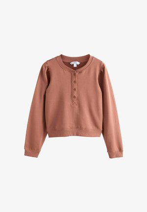 Felpa corta a manica lunga color rosa pallido con colletto rotondo e patta con quattro bottoni, polsini e orlo a costine.