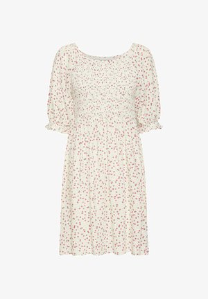 Florale katoenen jurk met korte puffmouwen, versmalde taille en een lichtcreme achtergrond. Bevat een klein roze bloemenpatroon over de hele jurk.