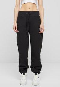 Karl Kani - SMALL SIGNATURE ESSENTIAL OS - Tracksuit bottoms - black Thumbnail Image 1