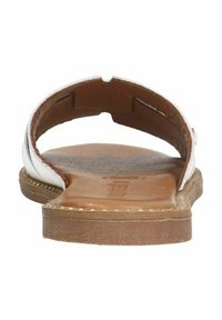 White leather slide sandal with an open back, brown textured sole, and a single strap design. Notable stitching along the edges.
