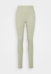 Leggings verde-azeitona com uma cintura alta, feitos de um tecido elástico. Apresentam uma textura suave e um design ajustado, sem costuras visíveis.