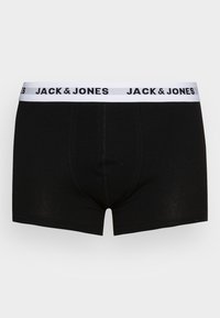 Boxer shorts en coton noir avec une ceinture élastique blanche portant "JACK & JONES" imprimé en noir. Texture lisse, design ajusté.