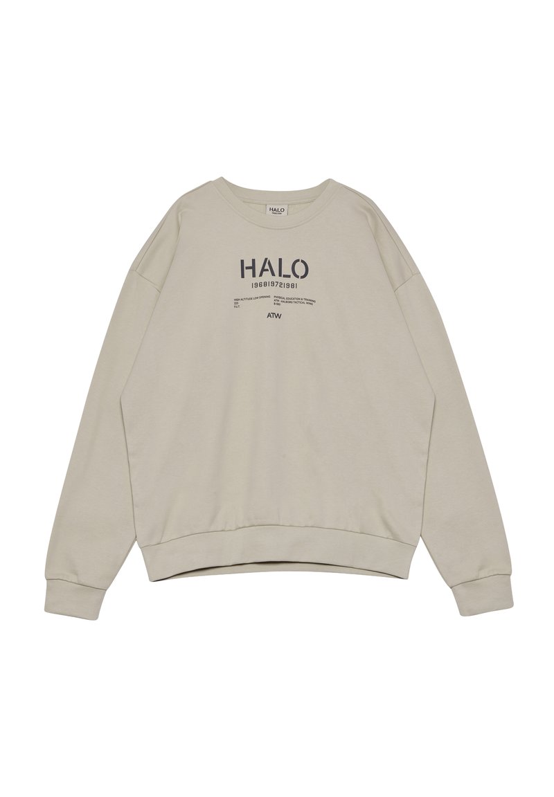 Felpa beige chiaro con scollo rotondo, spalle scese e polsini a coste. Presenta testo stampato in grigio scuro sul davanti.