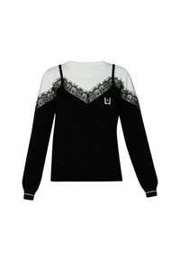 Pull noir et blanc à manches longues, avec un motif en dentelle sur la poitrine et des bretelles. Comprend un logo sur le devant.