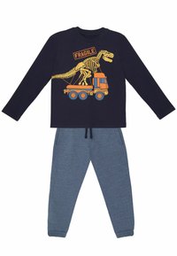 Langärmliges navy-blaues Oberteil mit einem Dinosaurier-Graphic und dem Text "FRAGILE", kombiniert mit grauen Sweatpants mit elastischem Bund.