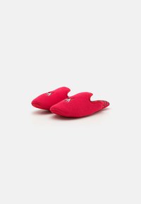 Red fabric slippers with a rounded toe and cut-out sides, featuring embroidered accents. Smooth texture with a soft, comfortable design.