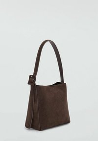 Brown suede handbag with a structured shape, a single brown leather handle, and a side knot detail, featuring a smooth texture throughout.