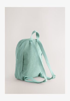 Cord-Rucksack in Minzgrün mit gepolsterten Schultergurten, einem Tragegriff oben und einer Seitentasche. Verfügt über eine strukturierte, gerippte Oberfläche.