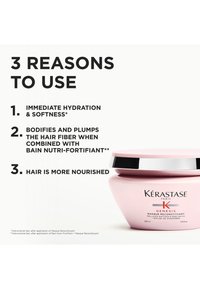 Masque capillaire Kérastase Genesis, pot rose avec un couvercle argenté, mettant en avant une hydratation immédiate, la nutrition des cheveux et des propriétés volumisantes.