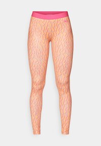 Leggings i fersken med et bølgete rosa mønster, med en ensfarget rosa linning. Laget av elastisk, glatt materiale for komfort og fleksibilitet.