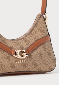 Brown patterned shoulder bag with a smooth texture, featuring a gold hardware logo and brown leather accents. Zippered top closure.