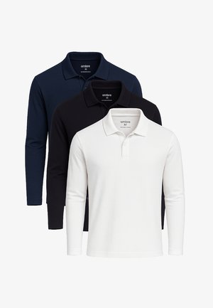 Tre polo a maniche lunghe nei colori navy, nero e bianco. Realizzati in cotone, presentano un colletto classico e una chiusura con bottoni.