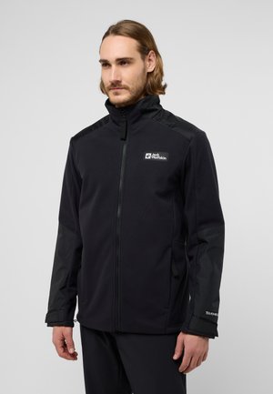Zwarte fleece jas met contrasterende glanzende mouwen, ritssluiting, hoge kraag en een logo op de borst. Beschikt over zijzakken en verstelbare manchetten.