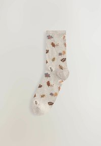 Vaalea harmaa sukka, jossa on kuviollinen design, jossa on lehtiä ja kukkia eri väreissä, mukaan lukien ruskea, sininen ja beige. Neulottu rakenne.