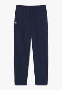 Pantalon bleu marine coupe décontractée avec ceinture élastique et petit logo crocodile vert sur la hanche gauche.