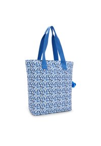 Blå tote bag lavet af stof, med et hvidt bladmønster, to blå håndtag og en lille blå pom-pom detalje på siden.