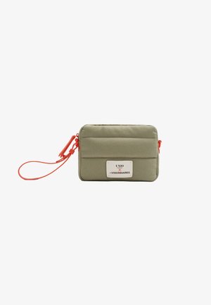 Olive green rectangular pouch with red zipper and strap, featuring a white label with black and red text on front.