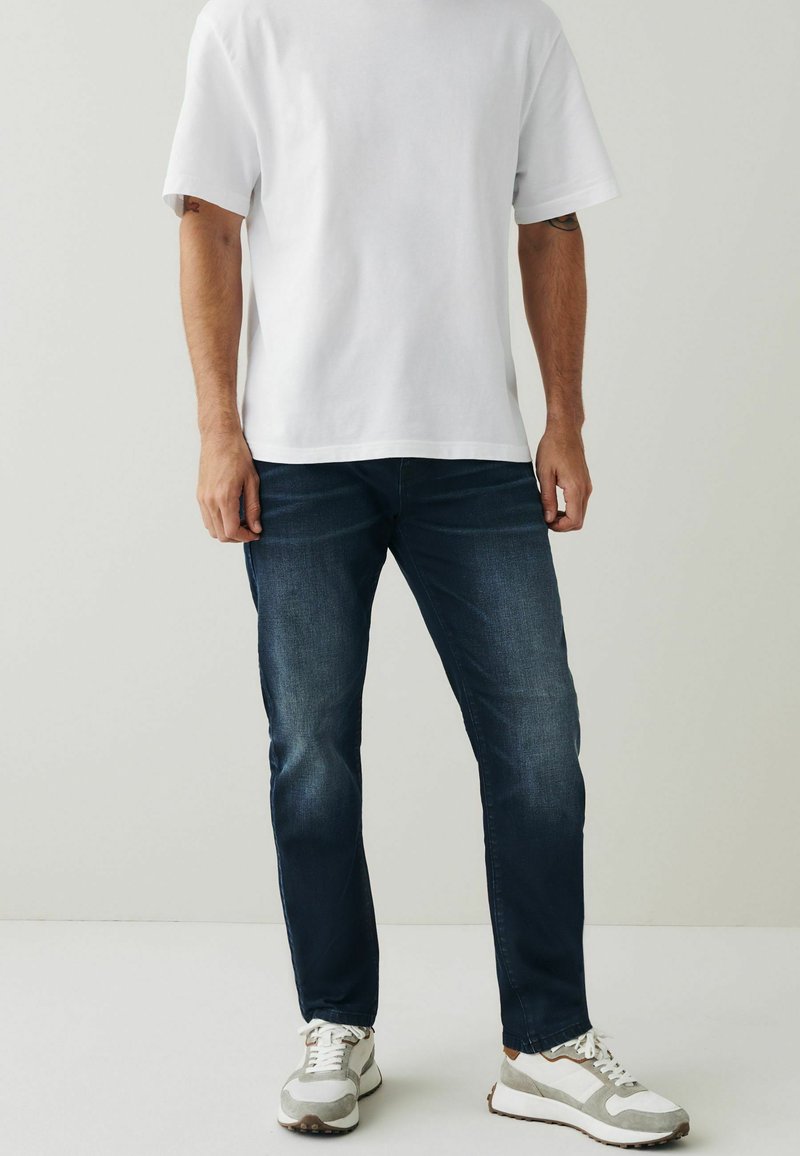 Next STRETCH Slim fit jeans coated blue/blauw Zalando.nl