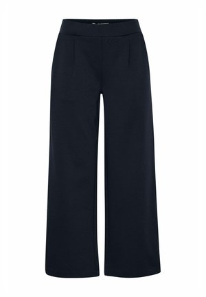 weite Hosen aus dunkelblauem Stoff mit einem glatten Bund und vorderen Falten. Das Design betont eine lässige Silhouette und eine maßgeschneiderte Verarbeitung.
