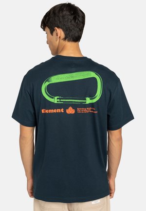 Navy blue cotton T-shirt featuring a large green carabiner graphic on the back with the text "SKATE CO. WORLDWIDE" and orange brand name.