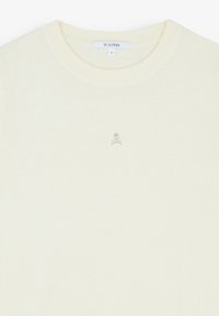 Helles gelbes T-Shirt mit Rundhalsausschnitt, aus weichem Stoff. Besitzt ein kleines Logo mit Totenkopf und gekreuzten Knochen in Silber. Größe S.