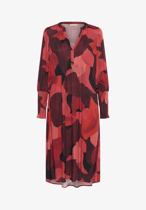 Punane ja must mustriga kleit pikkade varrukatega, V-kaelusega ja smock-detailidega varrukatel. Kerge, voolav kangas.