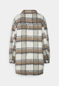 Long-sleeve, buttoned wool shirt jacket with a brown, beige, and white plaid pattern shown from the back on a white background.