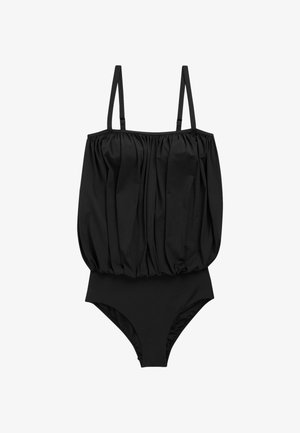 Bañador negro de una pieza con una parte superior suelta, fruncida y tirantes finos ajustables.