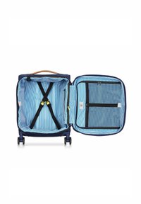 Valigia blu navy con manico beige, dotata di un interno a righe blu, cinghie incrociate e una tasca in rete con zip sul lato destro.