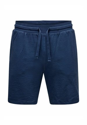 Shorts en bleu marine avec taille élastique et cordon de serrage, dotés d'un tissu texturé et de poches latérales. Design décontracté pour le confort et la flexibilité.