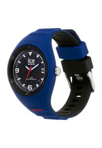 Blue silicone watch with a black dial, white numerals, red accents, and a stainless steel buckle. Water-resistant up to 10 ATM.