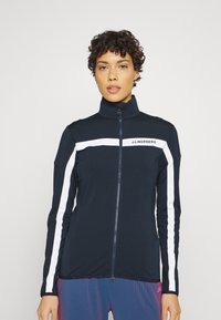 J.LINDEBERG Sports - JANICE MID LAYER - Vetoketjullinen college - navy Pienoiskuva 1