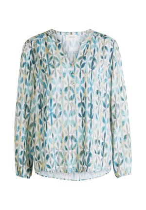 Blouse à manches longues avec décolleté en V, trois petits boutons, et un motif de feuilles bleu-vert sur fond blanc.