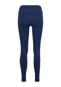 Marinblå ribbade leggings med hög midja, åtsittande form och muddade kanter, tillverkade av ett stretchigt och mjukt tyg.