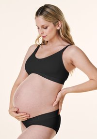 Czarny stanik ciążowy i pasujące majtki, bezszwowy design, miękki materiał, elastyczny i wspierający, z regulowanymi ramiączkami dla komfortu.