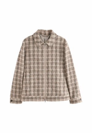Veste à fermeture éclair à carreaux beige et marron avec col, manches longues et poignets boutonnés sur fond blanc uni.