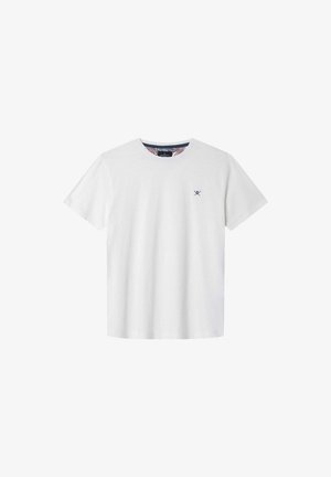 Bílá bavlněná tričko s krátkým rukávem, kulatým výstřihem a námořnickým křížem na levé straně hrudníku. Disponuje vzorovaným vnitřním výstřihem.