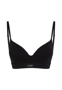 Bralette noir avec de fines bretelles réglables, un design en V plongeant et une texture lisse. Présente une bande logo au bas.