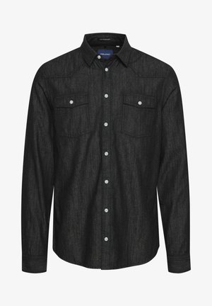 Chemise noire à boutons, réalisée en tissu texturé, avec des manches longues, deux poches poitrine avec rabats et des boutons blancs.