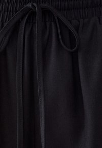 CALLI BETH - Hlače - black