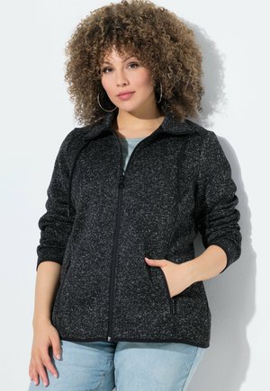 Veste zippée noire et grise marbrée avec un col montant, des manches longues et des poches avant. Texture douce avec des poignets et un ourlet élastiques.