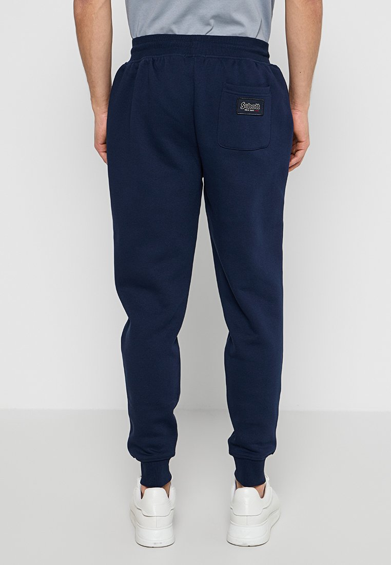 Pantaloni da jogging blu navy in cotone, con vita elastica, fondo delle gambe affusolato e tasca posteriore con logo.