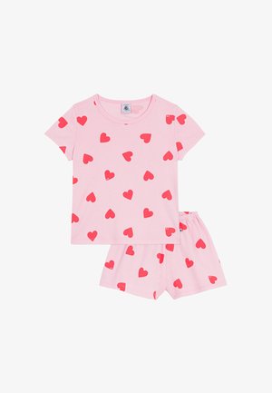 Rózsaszín pamut pizsamaszett rövid ujjú felsővel és hozzáillő rövidnadrággal, mindkettőn piros szívminták szórva. Puha tapintású anyag és rugalmas derékpánt.