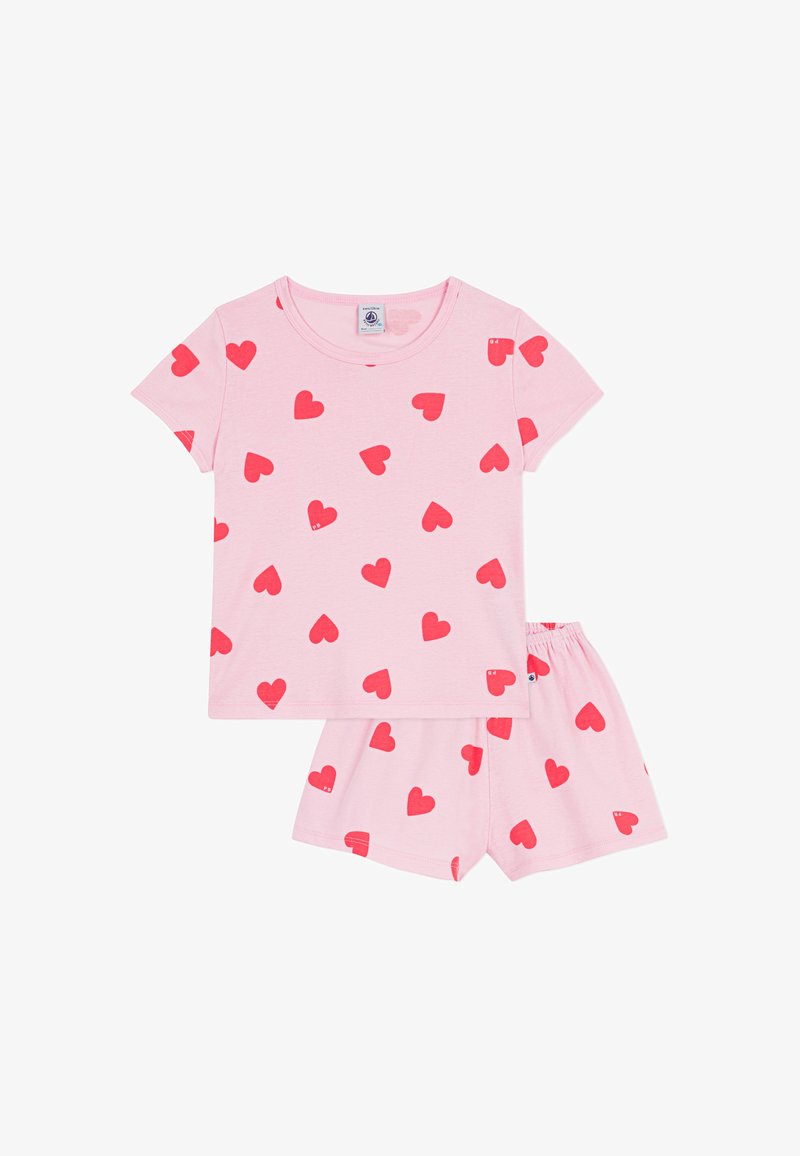 Σετ ροζ βαμβακερές πυτζάμες που περιλαμβάνει μπλούζα με κοντά μανίκια και αντίστοιχο σορτς, και τα δύο διακοσμημένα με διάσπαρτα κόκκινα μοτίβα καρδιάς. Μαλακή υφή και ελαστική μέση.